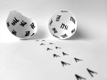 Eggshells with drawings on white background