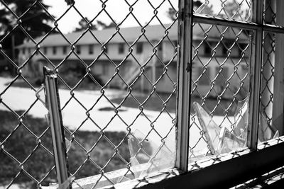 Chainlink fence seen through chainlink fence
