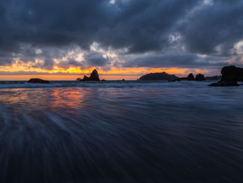 Scenic view of sea against dramatic sky