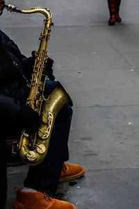 Low section of man standing on street