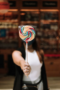 Midsection of woman holding ice cream