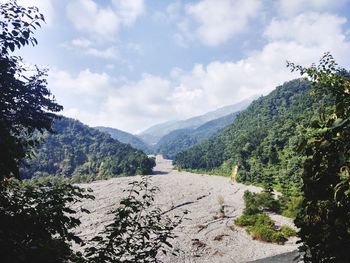 Scenic view of landscape and mountains against sky