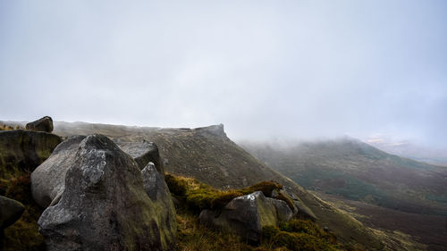 Low angle view of rock formations against sky