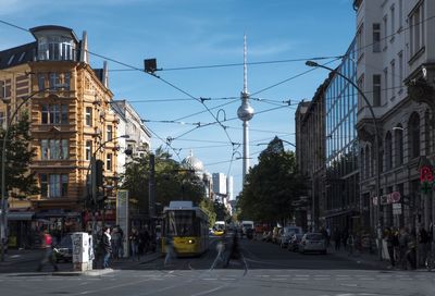 Road amidst buildings against sky