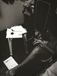 Low section of man using smart phone