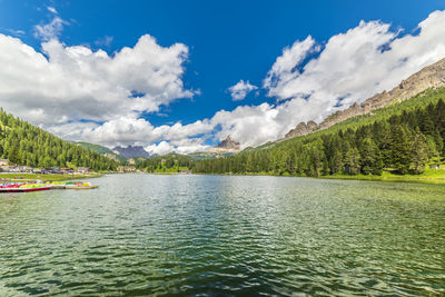 Scenic view of lake and mountains against sky