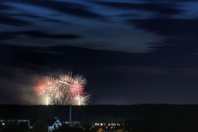 Firework display at night