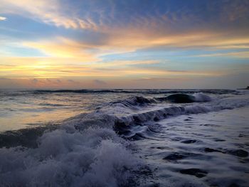 Scenic view of sea against sky during sunset