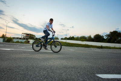 Man riding bicycle on road