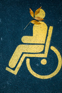 High angle view of disabled sign on street