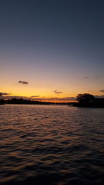 Scenic view of sea against sky at sunset