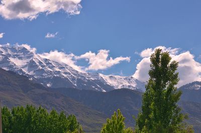 Scenic view of mountains against cloudy sky