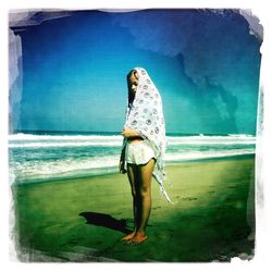 Woman standing on beach