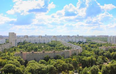 Panoramic view of trees and buildings against sky