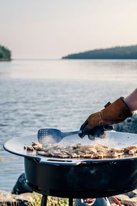 Cropped hand of man preparing food