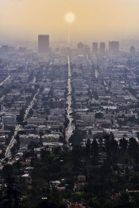 Aerial view of city buildings during sunset