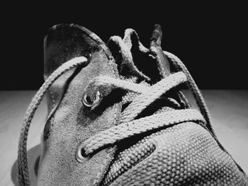 Close-up of a dog over black background