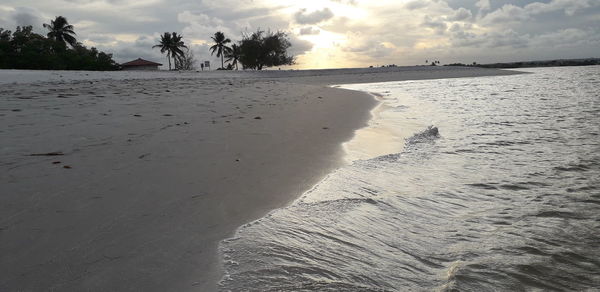 Scenic view of beach against sky during sunset