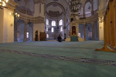 Woman sitting in temple