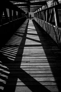 Shadow of person on footbridge