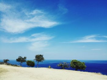 Scenic view of sea against blue sky