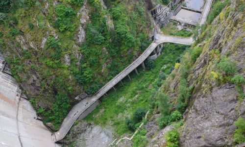 High angle view of bridge over road amidst trees