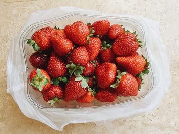High angle view of strawberries in bowl on table