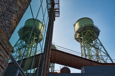 Low angle view of factory against sky