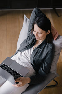 High angle view of woman using mobile phone