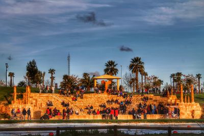 People sitting on steps at park