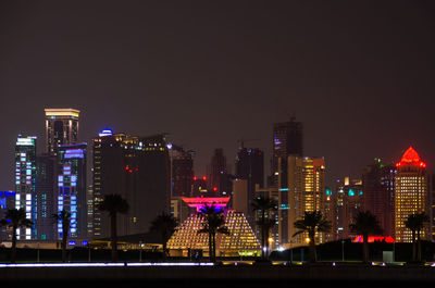 Illuminated buildings in city at night