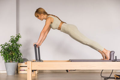 Low angle view of man exercising in gym