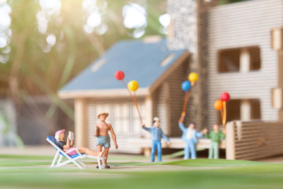 People playing with ball in yard