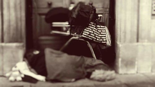 Rear view of woman sitting on chair