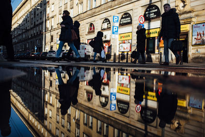 People walking on road in city