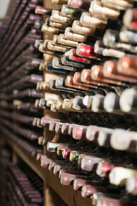 Wine bottles on rack in storage compartment