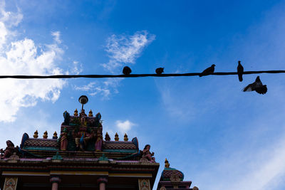 Low angle view of building against blue sky