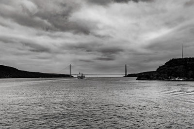 View of suspension bridge over sea