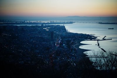 High angle view of illuminated buildings in city during sunset