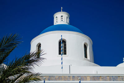 Low angle view of building against blue sky