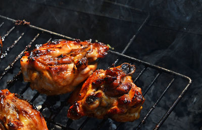 Close-up of meat on barbecue grill