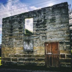 Low angle view of old building against sky