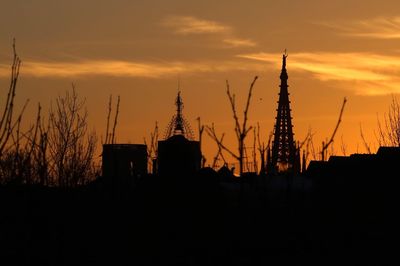 Built structure against sunset sky