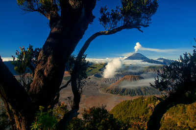 Smoke emitting from volcanic  bromo mountain