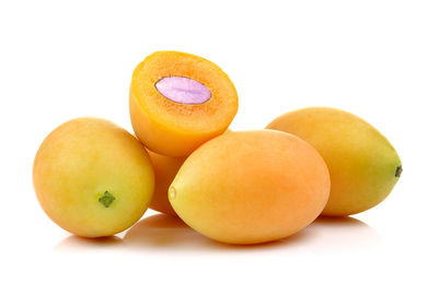 Close-up of oranges against white background