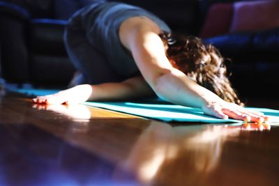 Midsection of woman relaxing on table