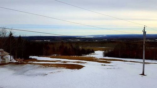 Electricity pylon on snow covered landscape