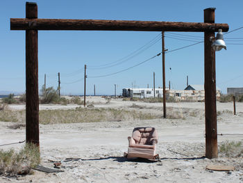 Lonely chair sits under entrance to abandoned lot at the salton sea