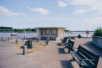 Chairs and table against sky