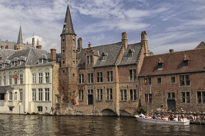 View of buildings against cloudy sky